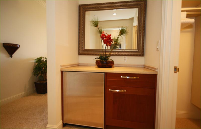 Guest services include a mini fridge and refreshment area, Ho'olei grand luxury on Wailea Beach, Maui.