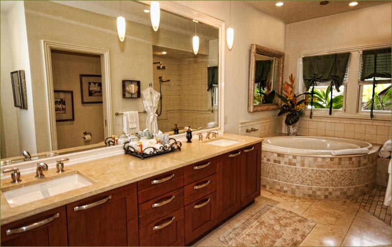The huge master bathroom includes twin vanities, a separate shower and whirlpool, soaking tub.