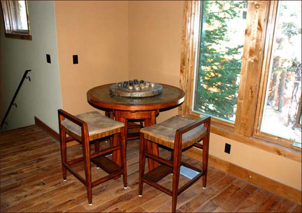 Small game table set apart in the loft of this self catering holiday rental in Mammoth, CA.