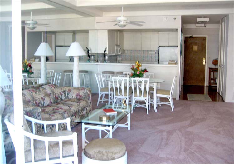 Spacious living room includes a comfortable sofa, private ocean view balcony, murphy bed and entertainment center with cable TV/DVD/VCR. 