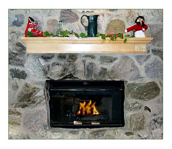 Decorated for Christmas each rental home includes a double sided, gas log fireplace