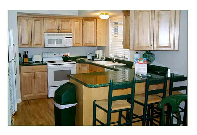 The Park City vacation rental's kitchen features a microwave and coffee maker plus other handy gadgets .