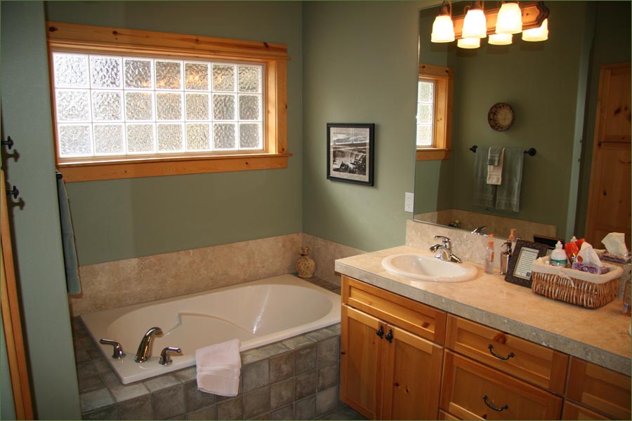Private master bathroom with large oversized tub and separate shower.