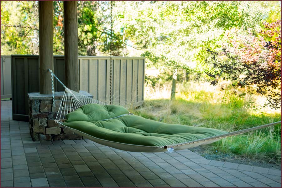 Easy life, relaxing in the large hammock on the back patio.