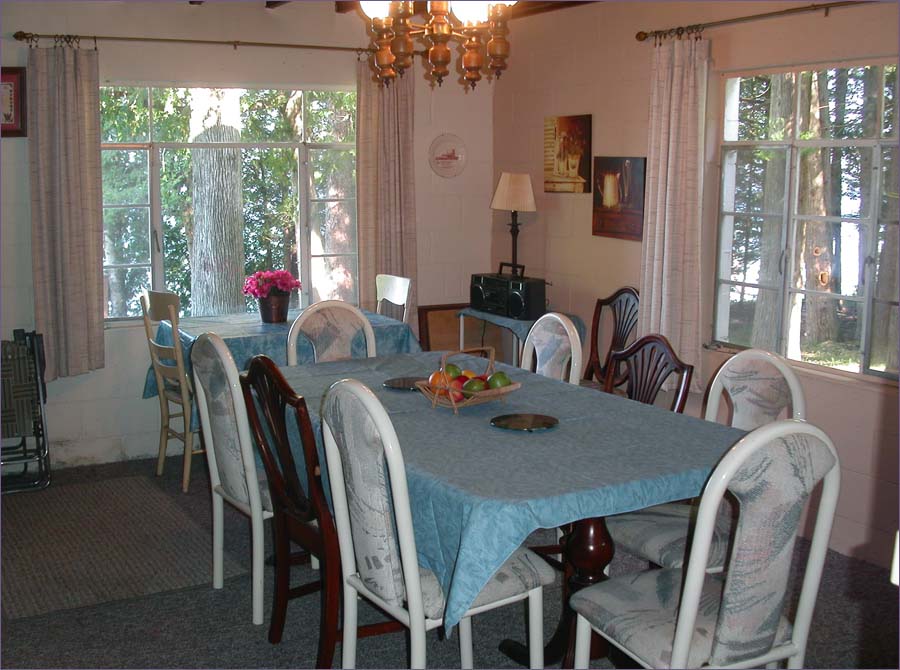Family dining room with lakeside window views and seating for 10.