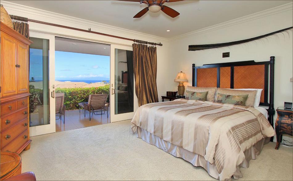 Elegant master bedroom with service center, mini-fridge and California king size bed with private lanai access