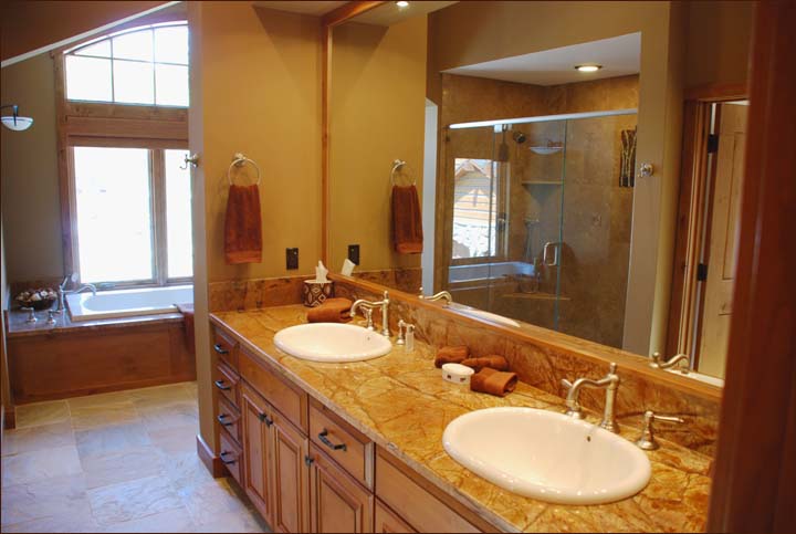 Radiant heated bathroom floors, lavish duel vanieties this generous and gracious master bathroom offers a separate shower and oversized bathtub.