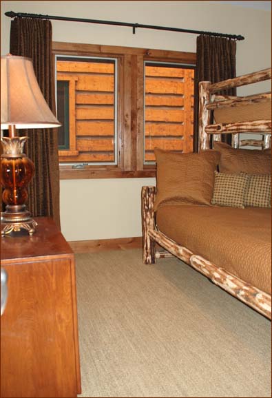 This toasty bunk room includes a queen/twin bunk bed and private bathroom with shower.