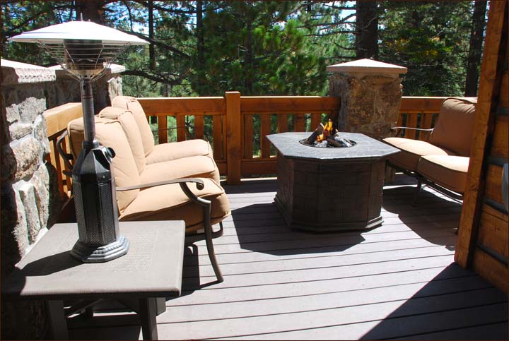 Private outdoor deck overlooking the Sierra Star Golf Course and surrounding woods features an outdoor barbecue and entertainment gas burning fire pit.