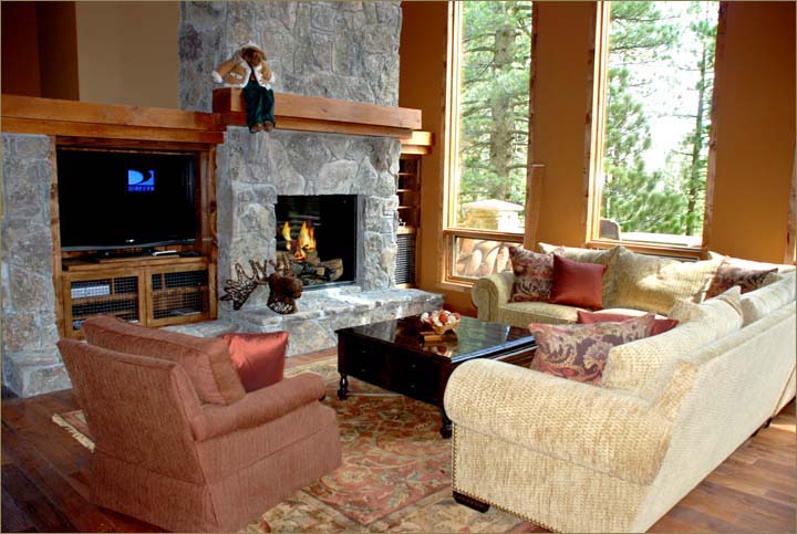 Spacious and beautifully furnished this Mammoth vacation rental luxury home features an unbelievable hand hewn timber ceiling and tall wide windows throughout.