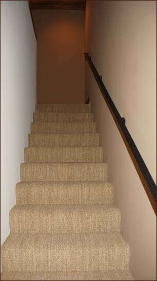 Stairway to the spacious loft and office leads upward from the master bedroom, powder room and extra shower.