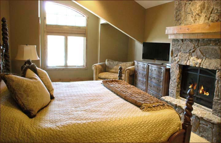 Main master bedroom features a king sized bed, large flat screen HDTV and private gas fireplace.