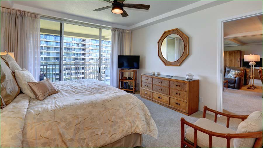 View of the master bedroom suite with private attached bathroom.