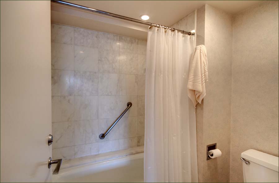 Master bathroom with full tub and shower.