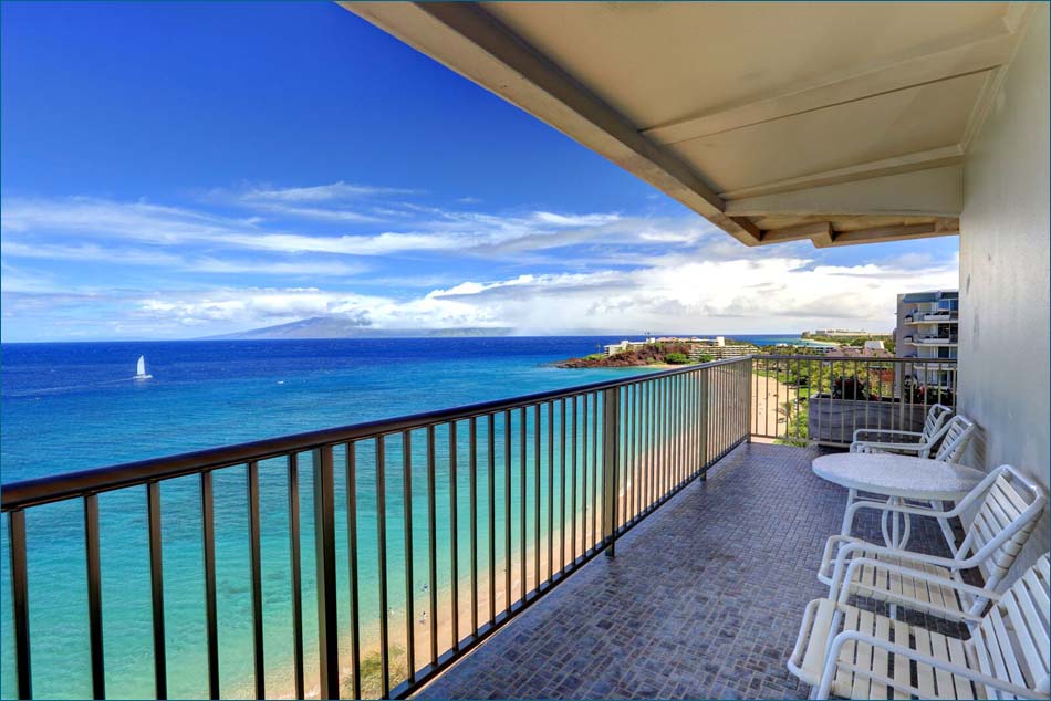 Large oceanfront private balcony, overlooking the shoreline, pool and resort.