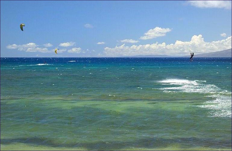 Parasailing at Maui beachfront vacation rental Maui Hawaii.