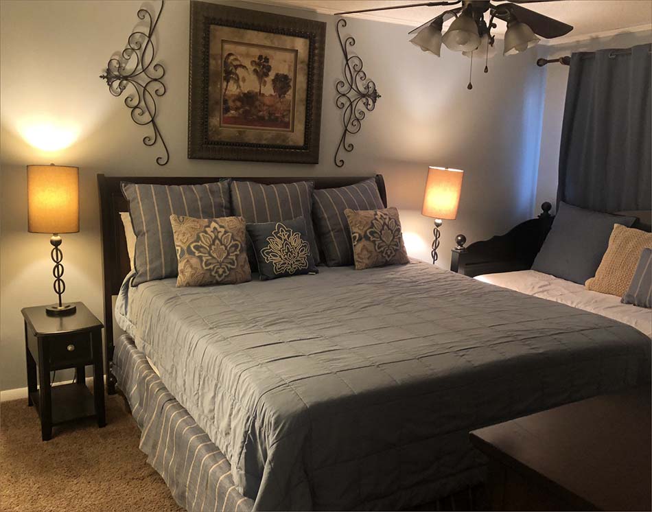Master bedroom has a king-size bed and twin daybed.