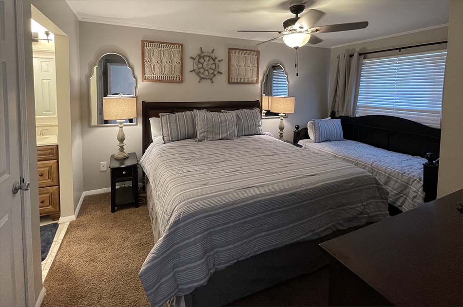 Master bedroom has a king-size bed and twin daybed.